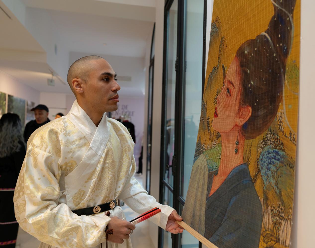 Guests viewing the bamboo silk painting 