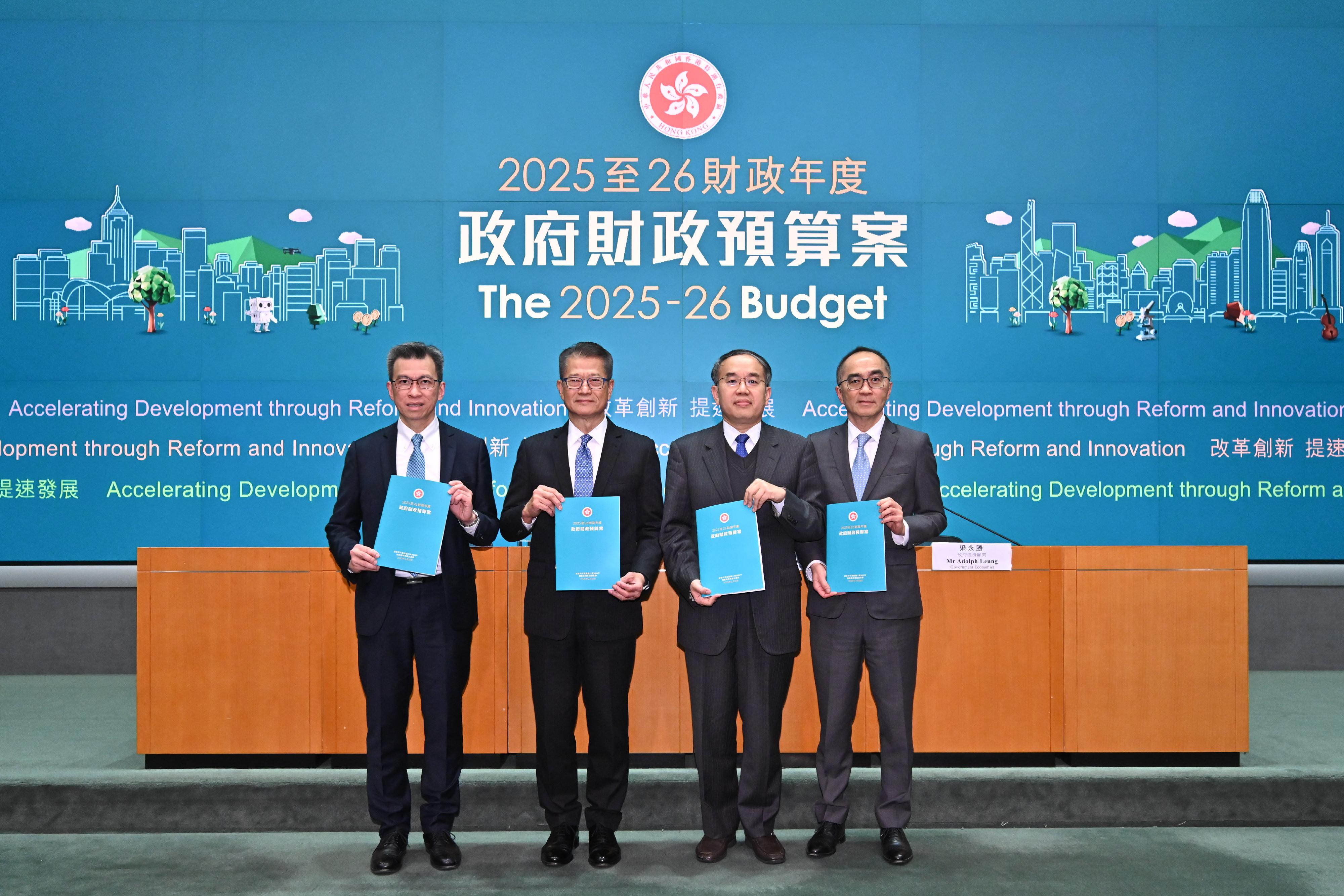 Hong Kong SAR’s Financial Secretary, Paul Chan (second left), at a press conference on the 2025-26 Budget