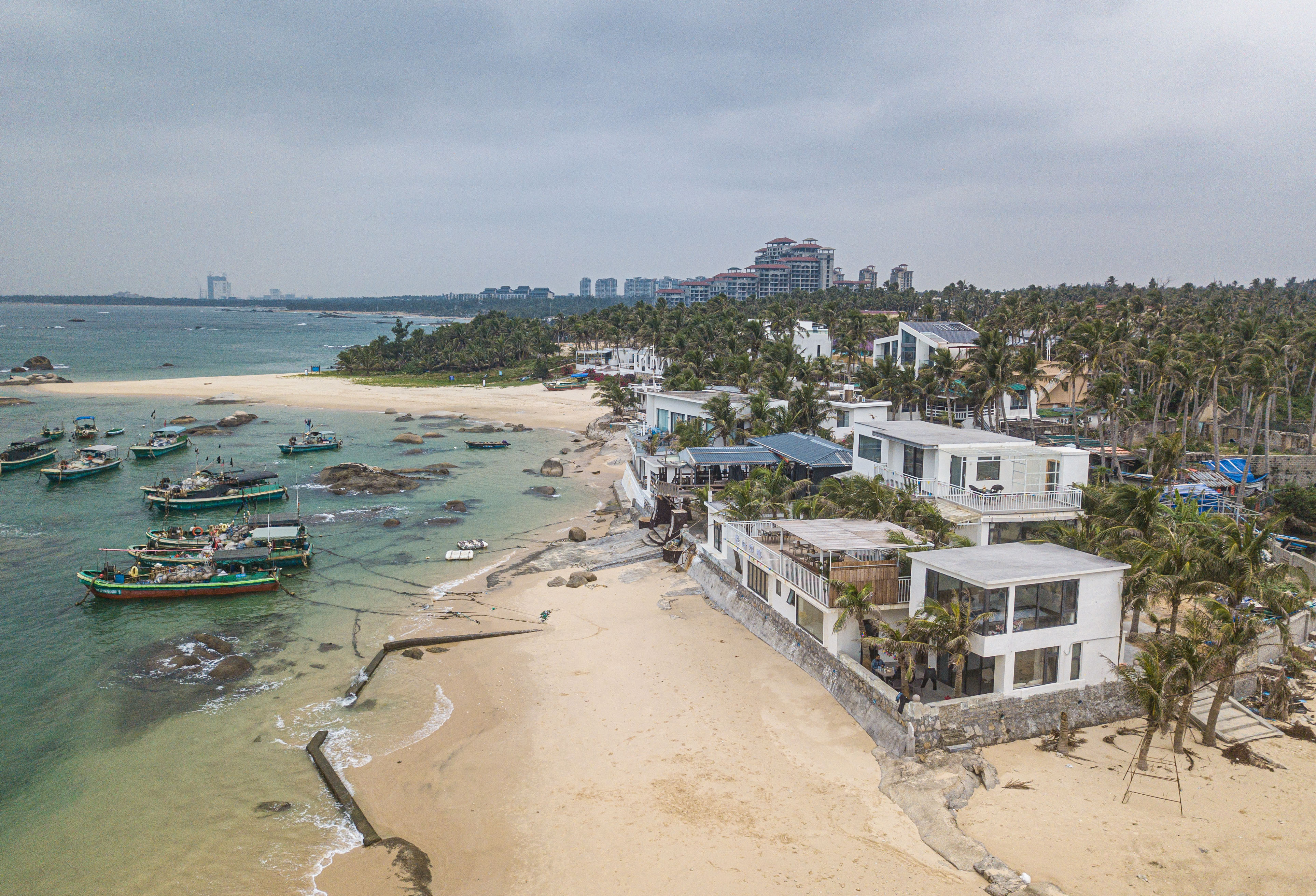 An aerial drone photo shows seaside homestays and coffee shops in Longlou Town, Wenchang, south China
